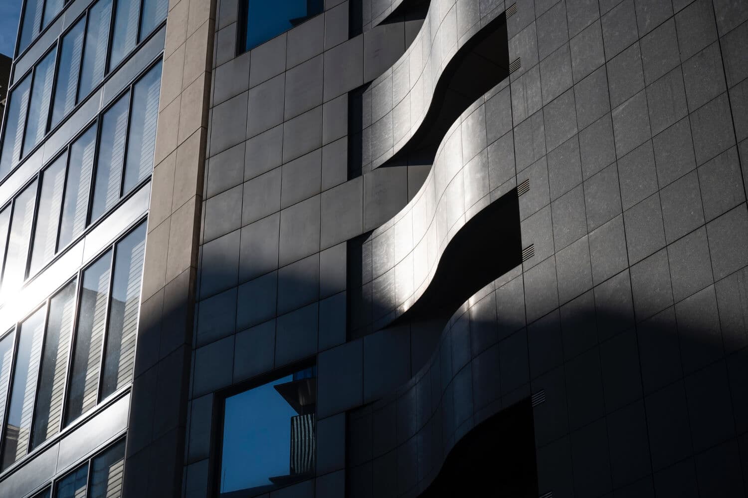 Modern building facade with curved balconies