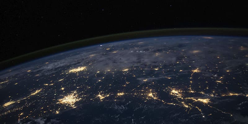 The illuminated earth representing the weight that the tokenization of digital assets will have